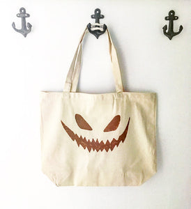 Jack-o-lantern face over sized canvas tote